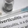 Syringe and medication on diverticulitis definition